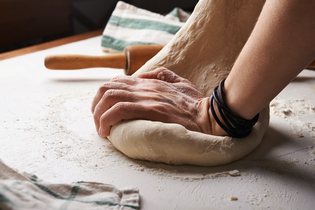 Hand kneading pasta dough